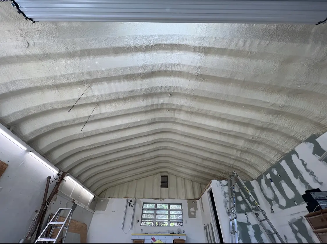 Spray polyurethane foam applied to the underside of a metal roof deck in Hermitage